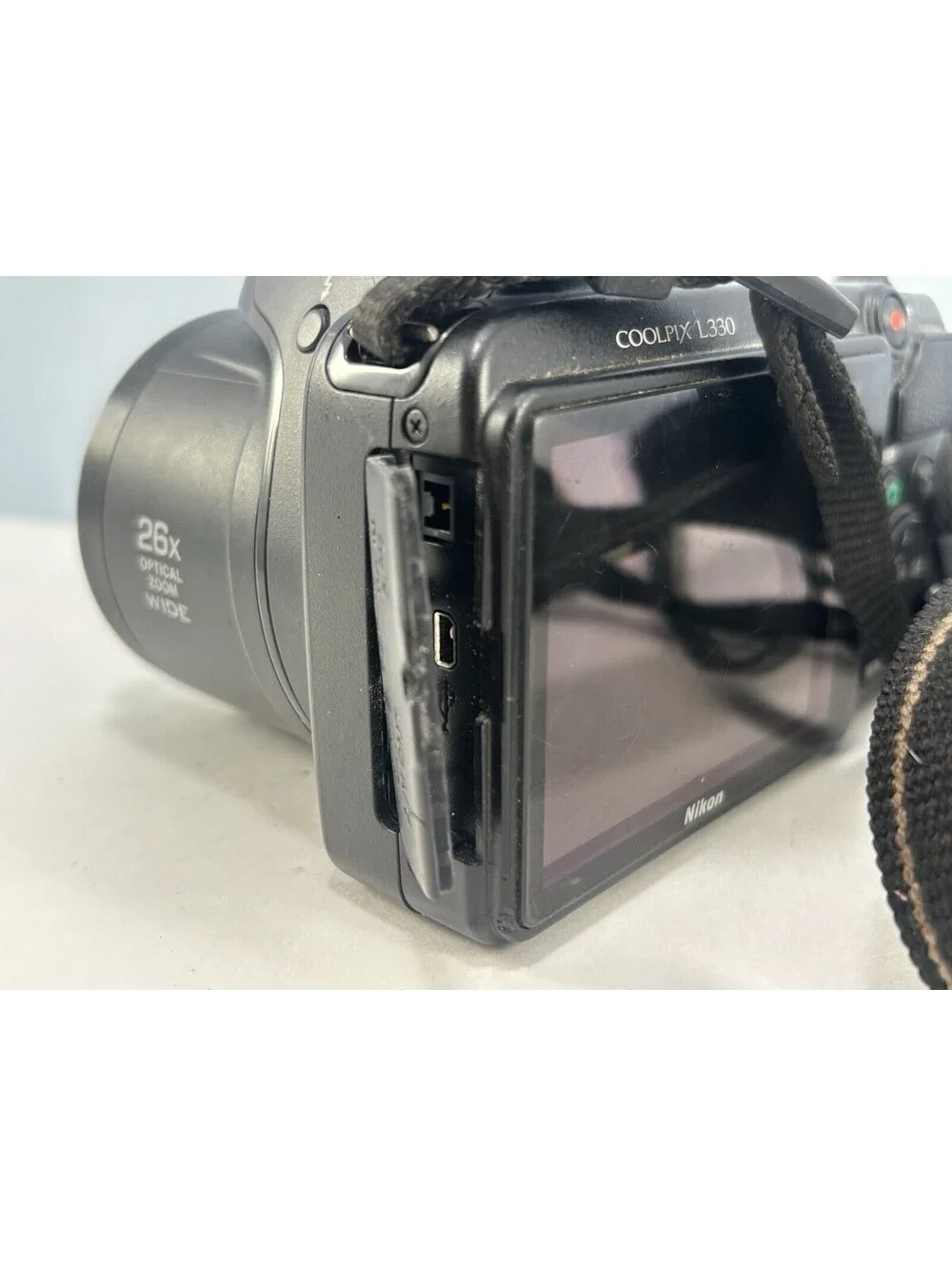 Nikon Coolpix L330 w/ Strap For Parts Or Repair - Missing Battery Door